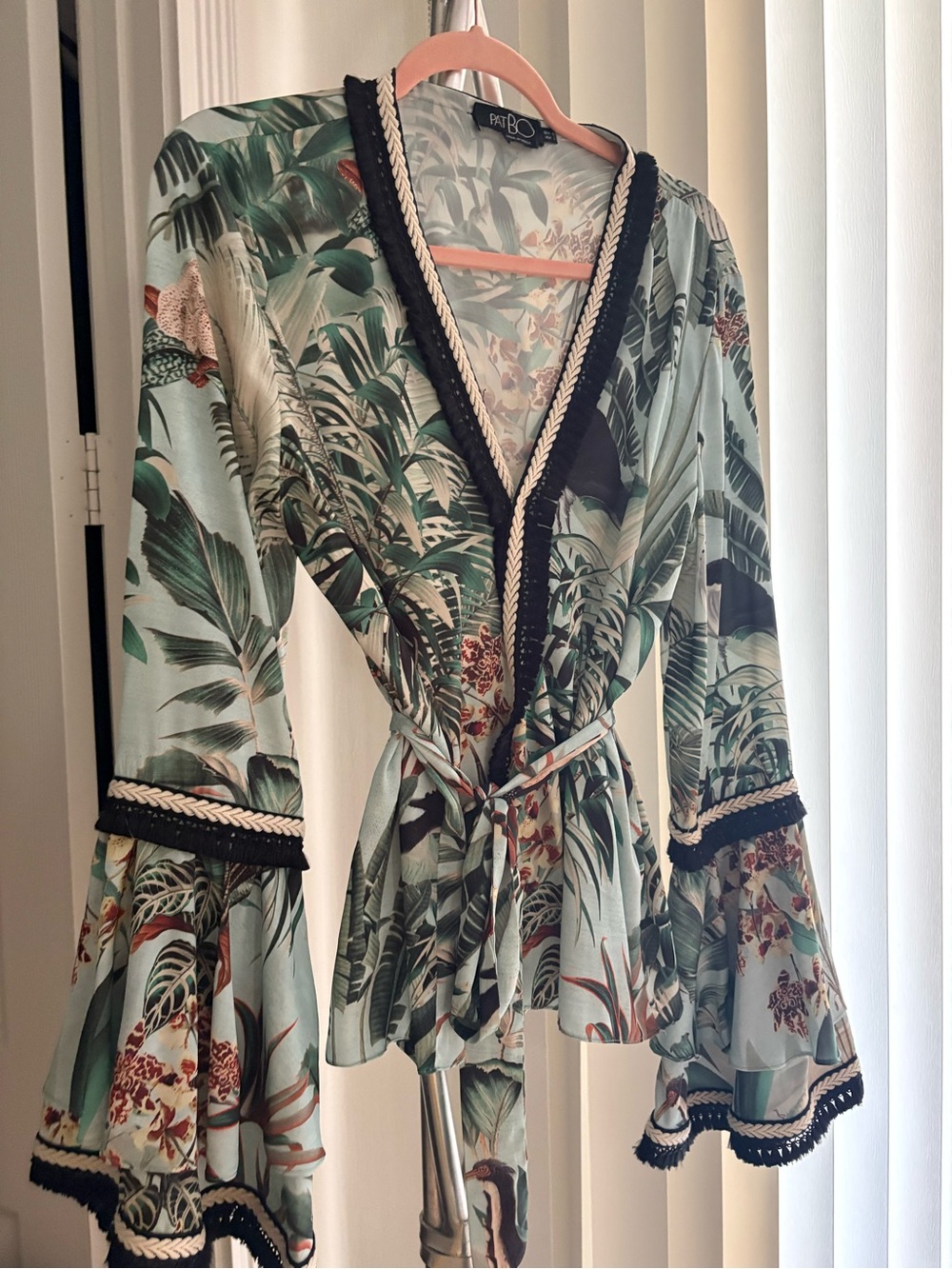 Femme Boho Green Tropical Wrap blouse with Black Trim and bell sleeves